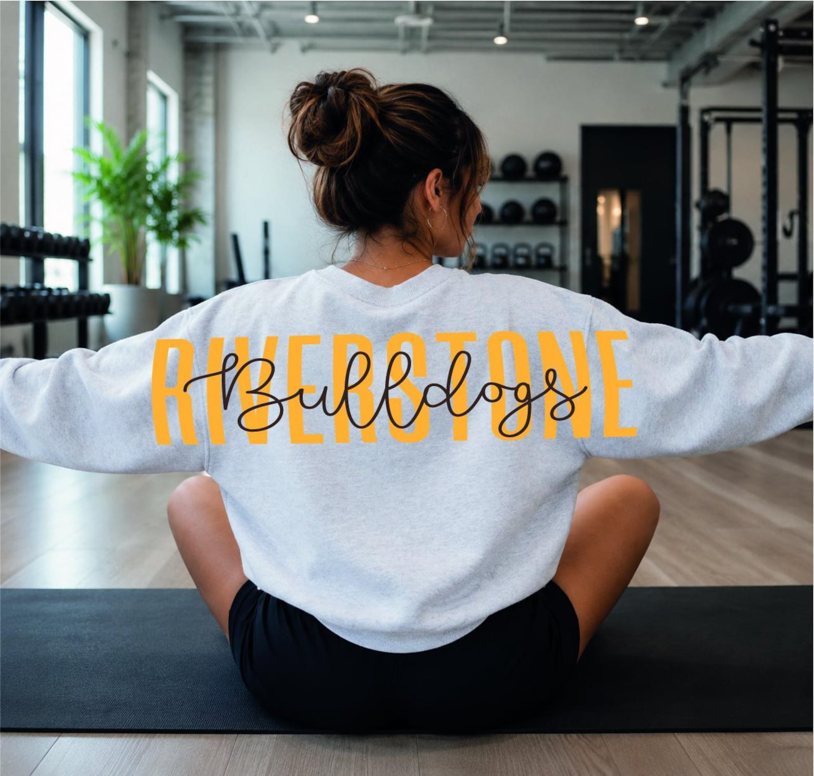 May_include_A_light_gray_long-sleeve_crewneck_sweatshirt_featuring_the_word_RIVERSTONE_in_large_yell_06-33-32-764Z